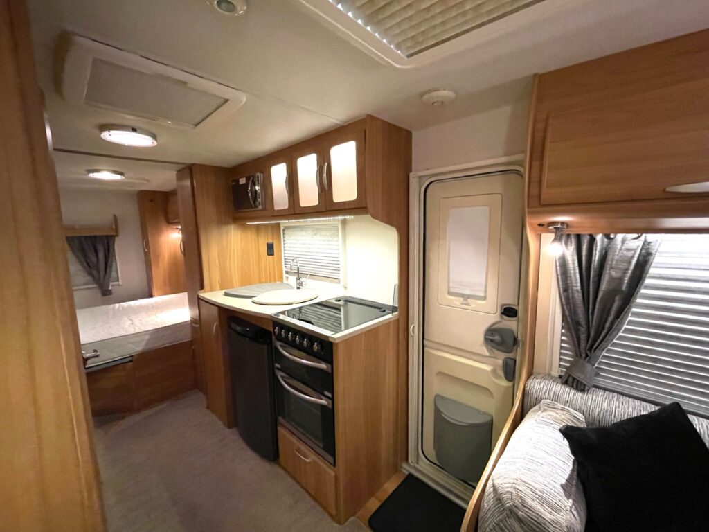 
								Lunar Ultima 560 – 4 Berth Fixed Island Bed Caravan With Awning full									